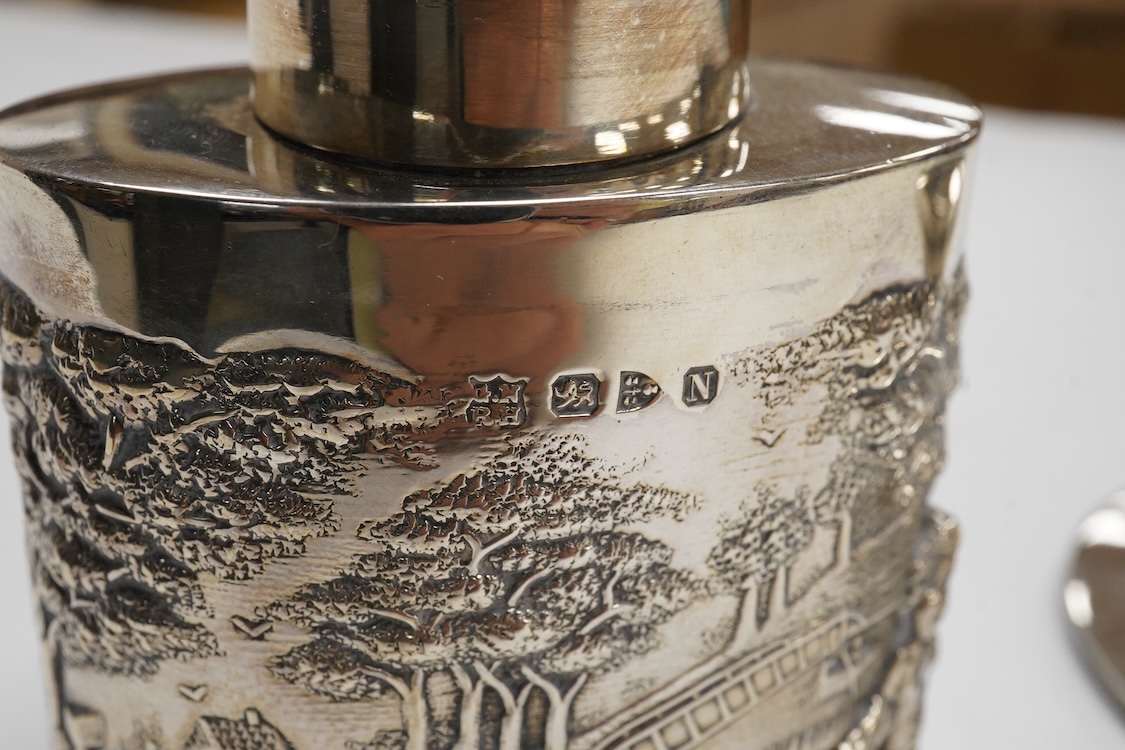 A late Victorian repousse silver oval tea caddy, by Nathan & Hayes, Chester, 1896, height 75mm, together with a George V silver mounted capstan inkwell.